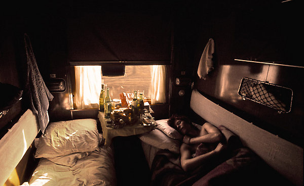 David Bowie photographed by Geoff MacCormack sleeping off a hangover on the Trans-Siberian Express in 1973