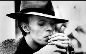 David Bowie photographed by Geoff MacCormack lighting up a Gitane cigarette in 1975